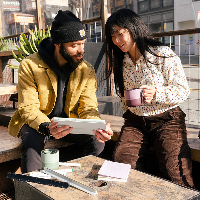 12oz-rise-mug-g5 12oz_rise_coffee_mug_dusty_orchid_couple_city_patio_square.jpg