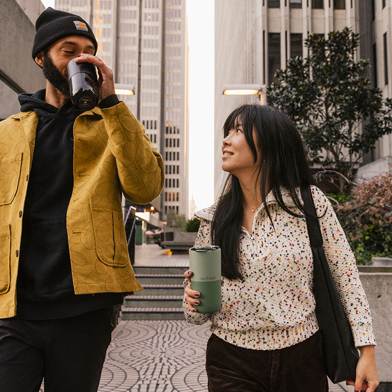 bring-your-own-party-kit-pints-and-tumblers-o9 16oz_rise_tumbler_black_iceberg_couple_drink_city_street_square.jpg