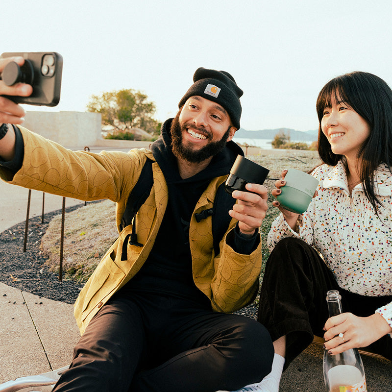bring-your-own-party-kit-tumblers-and-cocktails-i2 8oz_rise_lowball_black_iceberg_couple_selfie_city_square.jpg