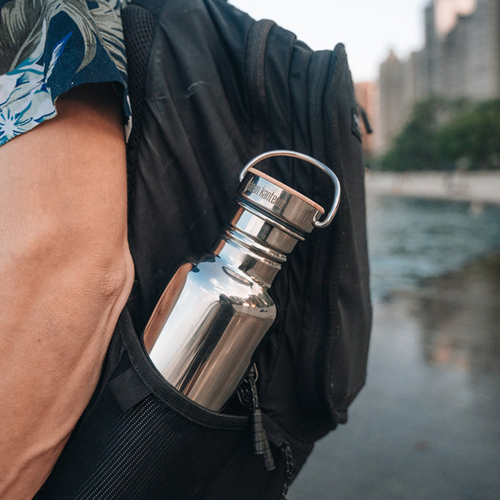 27oz-reflect-with-bamboo-cap-k4 K27SSLRF-MS-BAMBOO_reflect-bottle_backpack_lifestyle.jpg