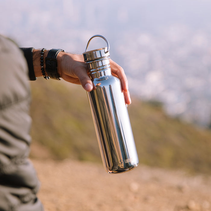 27oz-reflect-with-bamboo-cap-k4 K27SSLRF-MS-BAMBOO_reflect_bottle_hand_lifestyle.jpg