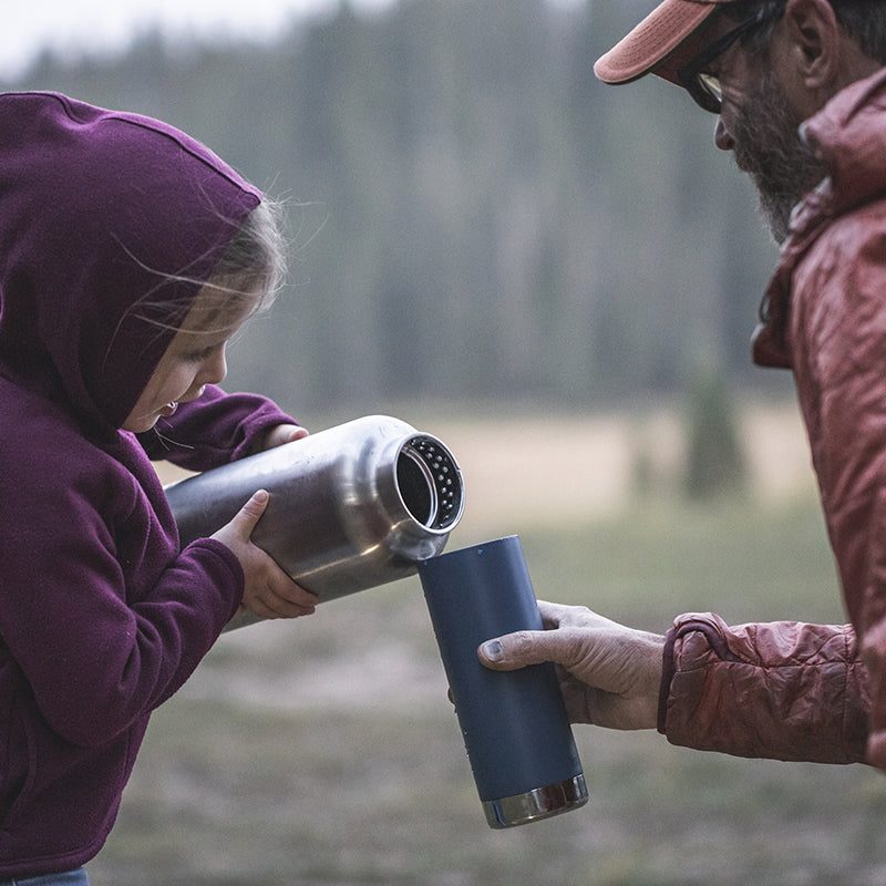 64oz-tkwide-with-loop-cap-q1 tkwide_64oz_bottle_girl_dad_filling_square.jpg